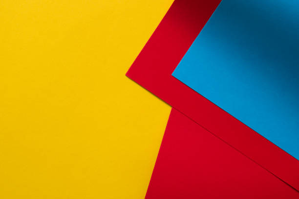 istock Yellow, red and blue abstract 3d colored paper background 1313691405