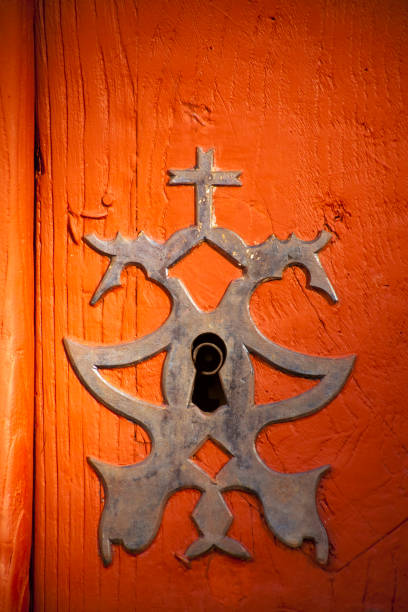 istock Ancient  decorated lock , red wooden door. 1313692288