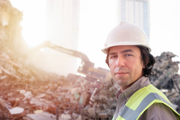 istock hardhat engineer at the construction site with construction machinery 1313692350