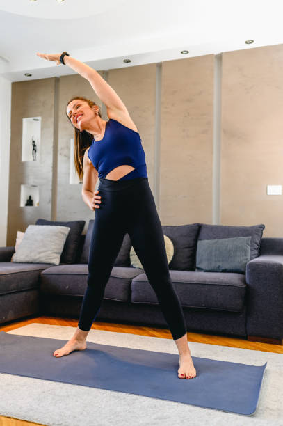 istock Woman exercising at home 1313697103