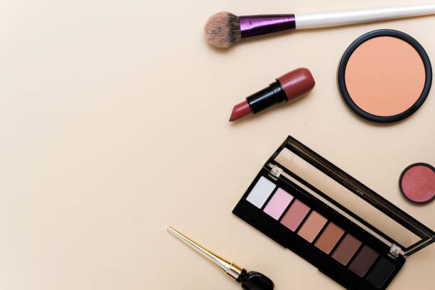 istock Decorative cosmetics. Lipstick, powder, eyeshadow palette and foundation for bright makeup. Copy space, flat lay. Beauty, fashion and shopping concept 1313697376