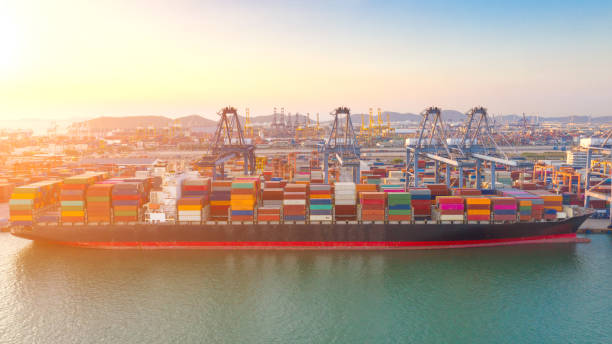 istock Container , container ship in export and import business and logistics. Shipping cargo to harbor by crane. Water transport International. Aerial view and top view. 1313700681