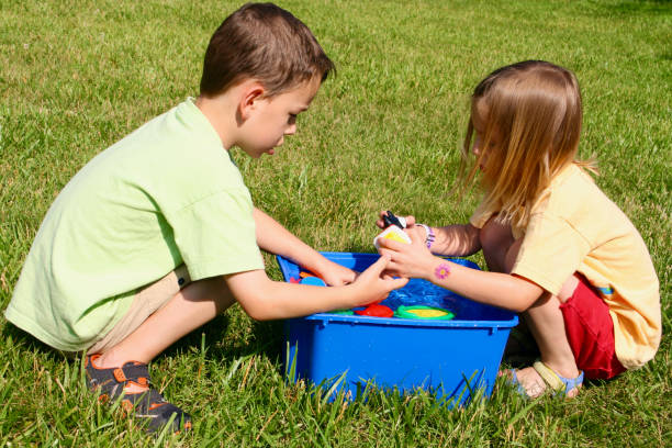 istock Children playing outdoors in the garden 1313700990