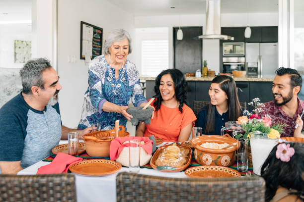 istock Multi-generation family eating together outdoors 1313701056