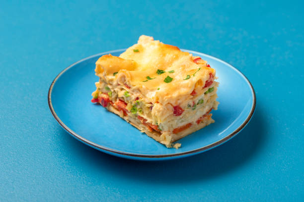 istock Vegetarian lasagna on a blue plate. Single portion of lasagna 1313704041
