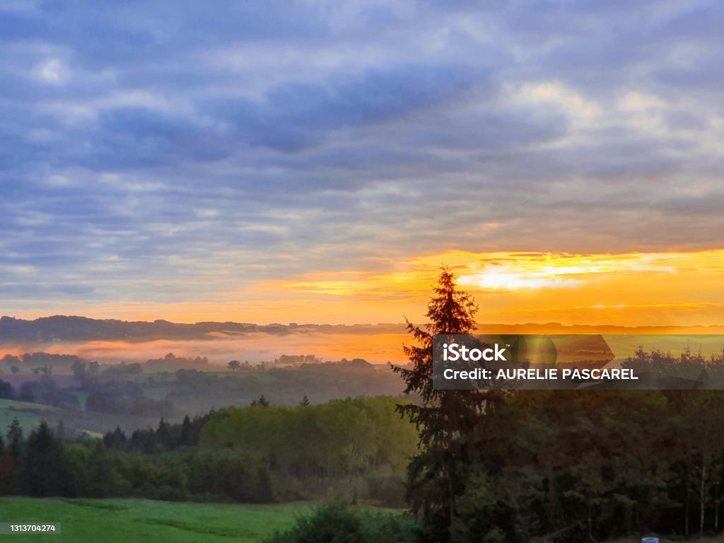 sunrise Magnificent sunrise over the Corrézienne countryside in the Limousin in Nouvelle-Aquitaine Beauty Stock Photo