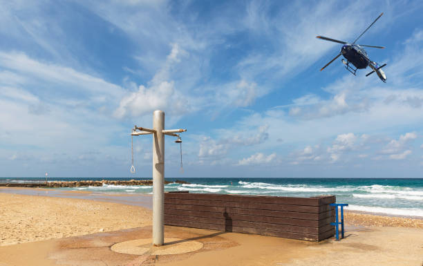 istock police helicopter flying over the beach 1313704838