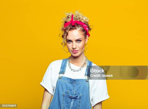 Young Woman In 80s Style Outfit Portrait On Yellow Background Stock Photo - Download Image Now
