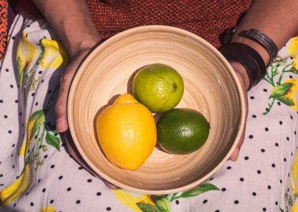 istock Bamboo bowl with limes and a lemon 1313706256