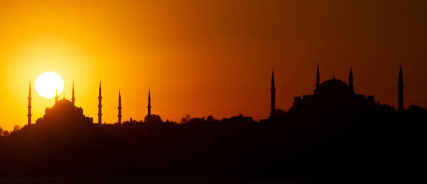 Istanbul at the sunset, Turkey Skyline of Istanbul in silhouette at the sunset with Blue Mosque and Hagia Sophia, Istanbul, Turkey golden horn istanbul photos stock pictures, royalty-free photos & images