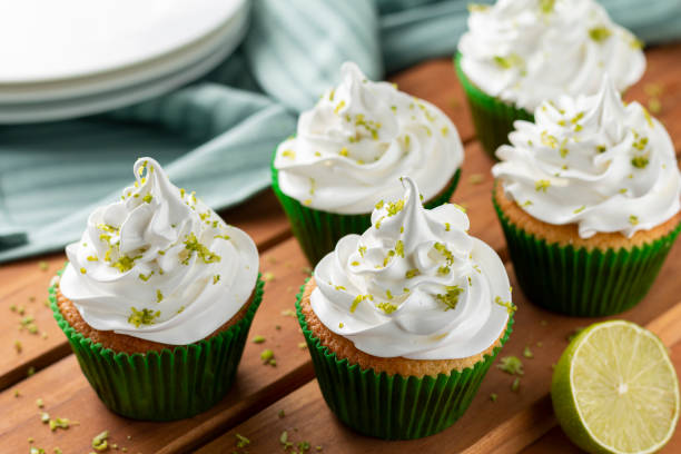 istock Tasty cupcakes with lemon on a wooden table. 1313710078