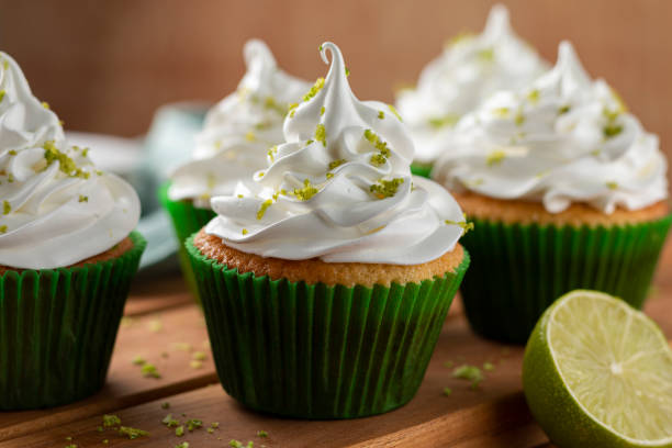 istock Tasty cupcakes with lemon on a wooden table. 1313710111