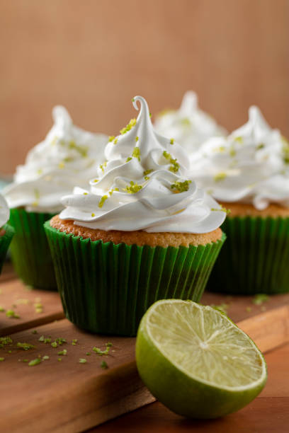 istock Tasty cupcakes with lemon on a wooden table. 1313710150