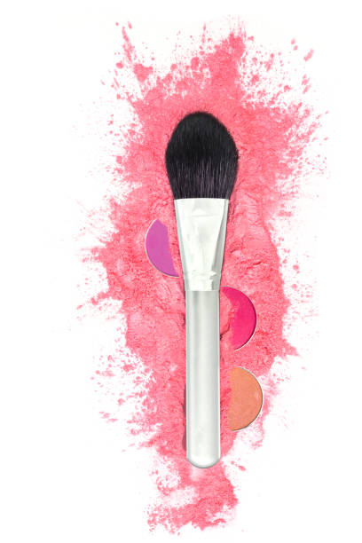 istock Makeup brush and pink powder on a white background, close-up.  View from above. 1313711932