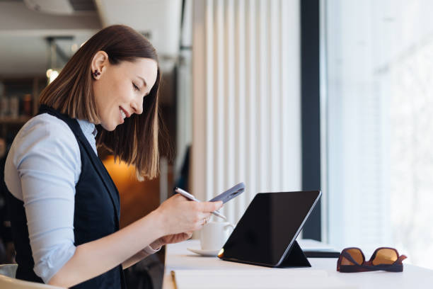 istock Caucasian beautiful woman using smart phone for business 1313715200