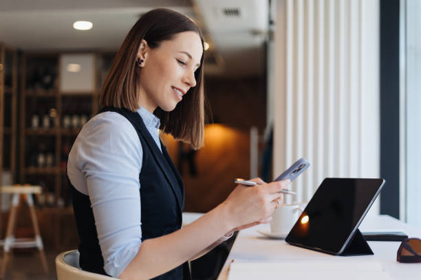 istock Caucasian beautiful woman using smart phone for business 1313715220