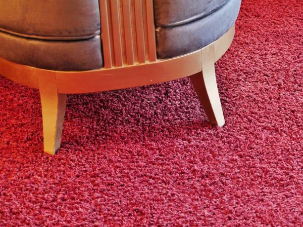 istock Armchair stands on red carpet 1313716368