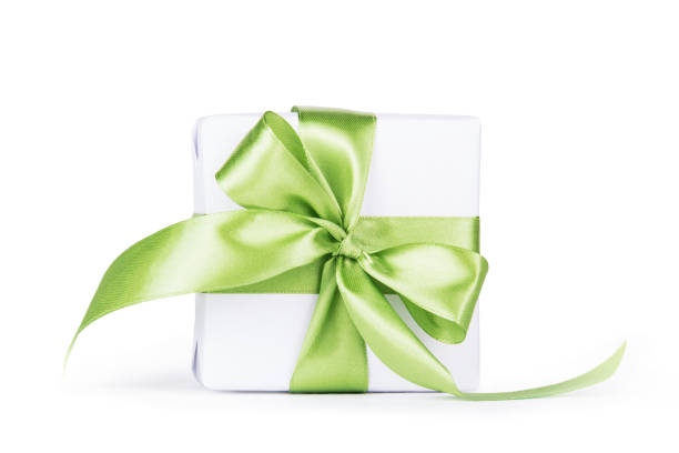 Gift box with a ribbon on a green background, gift for a woman, box for jewelry, expensive gift, gift with a ribbon
