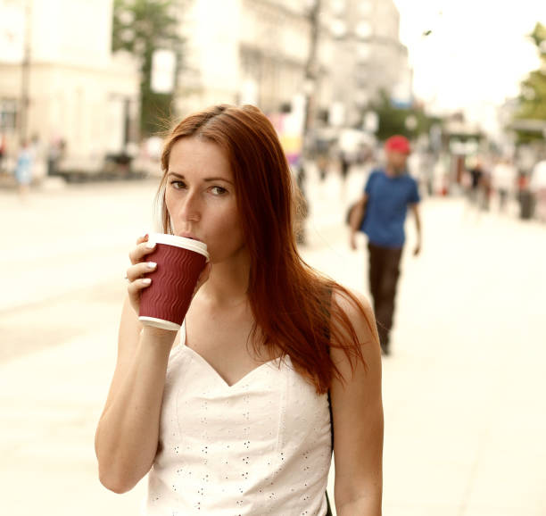 istock Young woman drinking coffee 1313718302