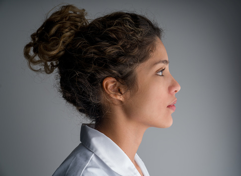 Profile portrait of a Latin American female doctor - healthcare and medicine concepts