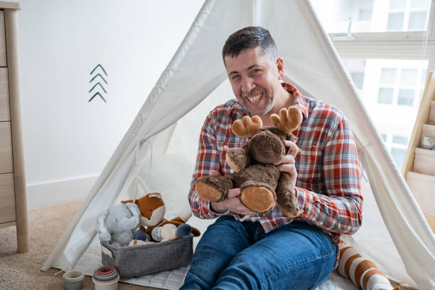 istock Happy father in the nursery room 1313721118