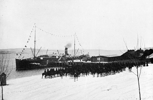 The Canadian Mounted Rifles boarding the SS Pomeranian in Halifax, Nova Scotia, Canada leaving for the Second Boer War in South Africa. Vintage etching circa 19th century.