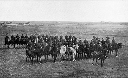 The group of North-West Mounted Police on parade in Regina, Saskatchewan (the North West Territories at the time) sent to the 2nd (Special Service) Battalion, Royal Canadian Regiment of Infantry for the Second Boer War in South Africa. Vintage etching circa 19th century.