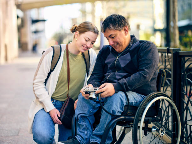 istock Disabled Man and a Friend in a Downtown Area 1313728264