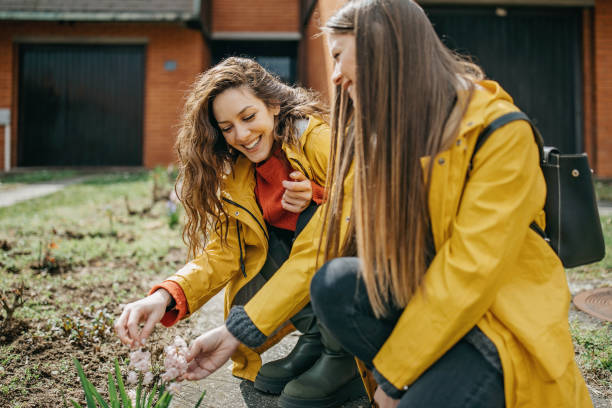 istock Two friends planting flower 1313730970