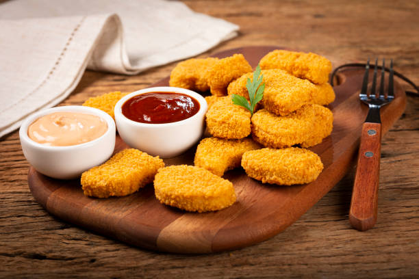 istock Fried chicken nuggets with ketchp and rose sauce. 1313732529