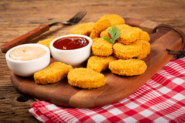 istock Fried chicken nuggets with ketchp and rose sauce. 1313732536