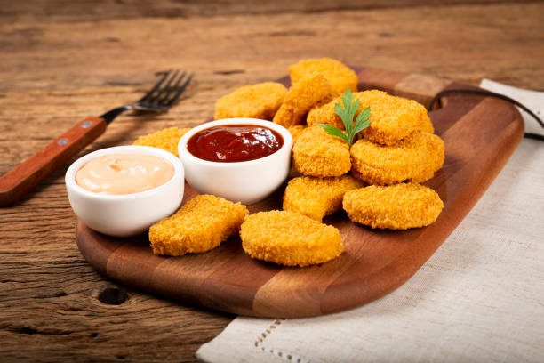 istock Fried chicken nuggets with ketchp and rose sauce. 1313732567