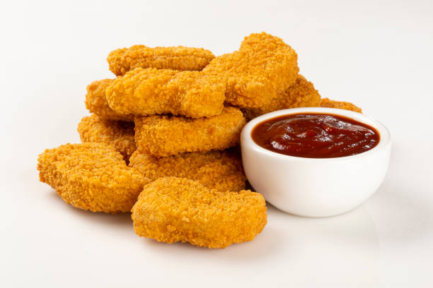 istock Fried chicken nuggets isolated on the white background. 1313732572