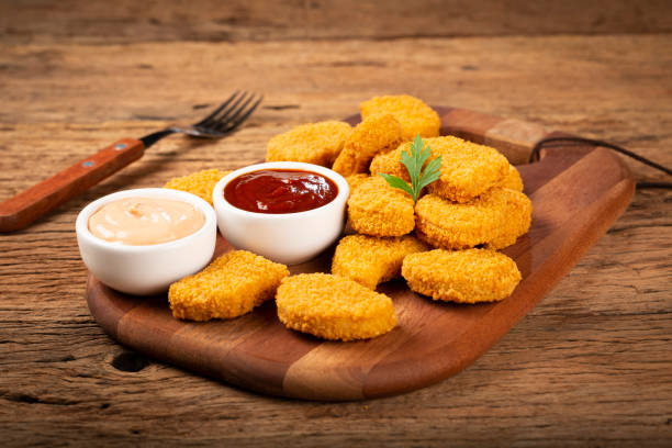 istock Fried chicken nuggets with ketchp and rose sauce. 1313732598