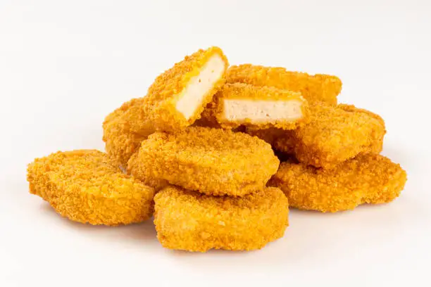 Fried chicken nuggets isolated on the white background.