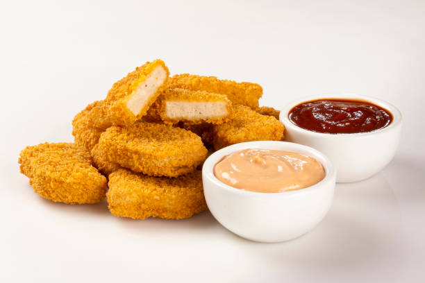 istock Fried chicken nuggets isolated on the white background. 1313732610