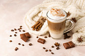 Latte Macchiato Coffee with Cinnamon, Chocolate and Coffee Beans