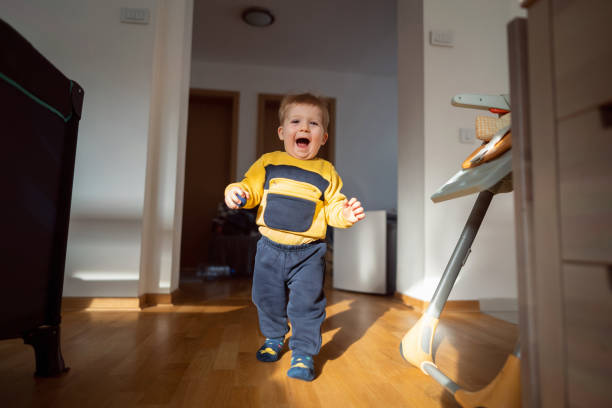 istock Joyful baby boy walking in the house 1313733506