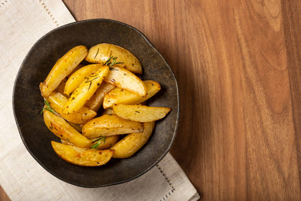 istock Roasted potatoes with rosemary on the plate. 1313733666