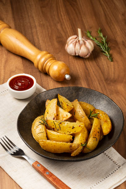 istock Roasted potatoes with rosemary on the plate. 1313733675