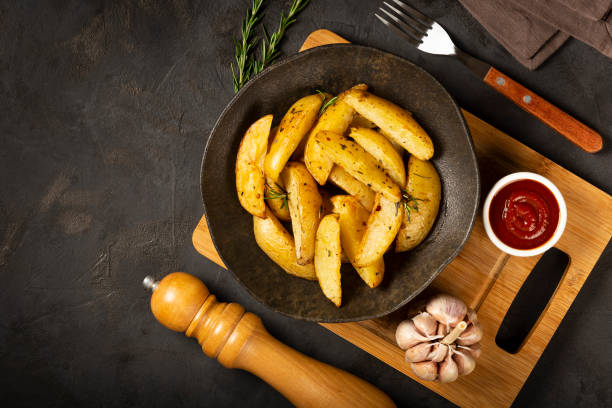 istock Roasted potatoes with rosemary on the plate. 1313733730
