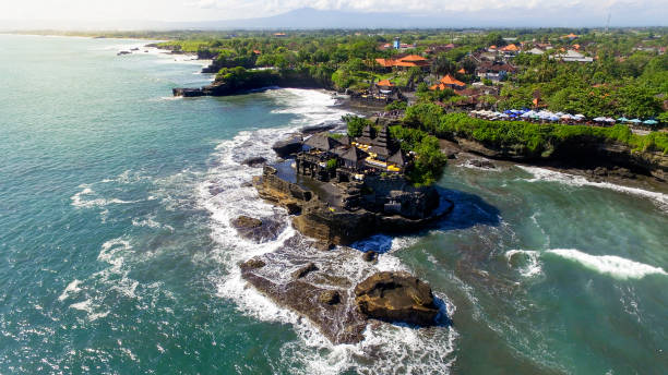 istock Tanah Lot Temple with big ocean waves crash 1313735589