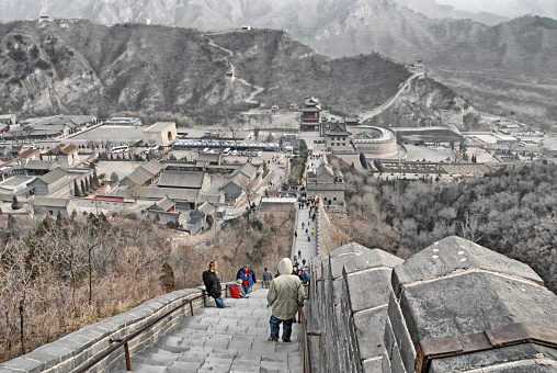 Badaling, China: Said to be the most visited section of the Great Wall of China is Badaling in the Juyong Pass about 70 miles south of Beijing and on this December day the sky was somewhat overcast and chilly it was exciting standing on the Great Wall of China.