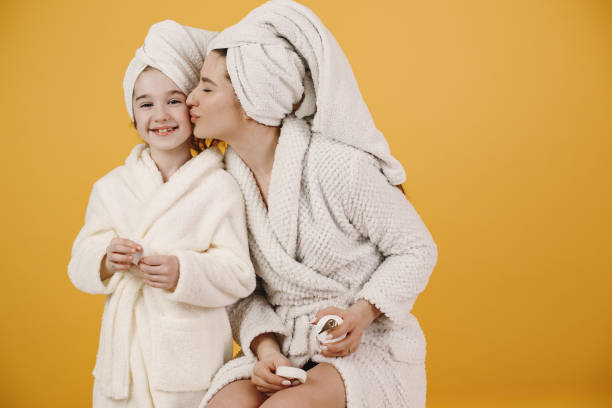 istock Mom and daughter doing makeup cosmetics 1313736409