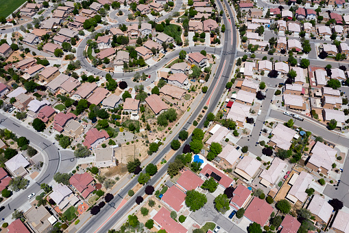 A neighborhood with red rooftops in New Mexico viewed from above.