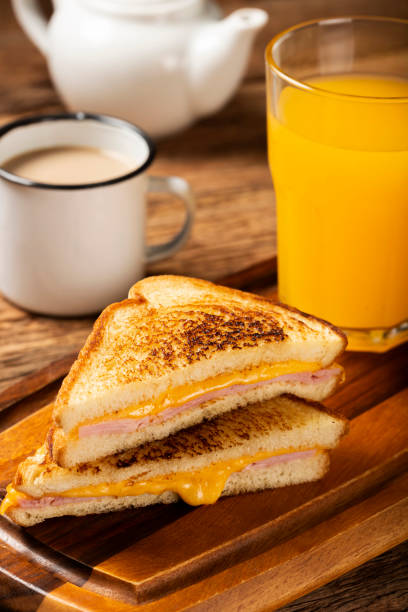istock Grilled ham and cheese. Sandwich with cheese and ham on grill. 1313739979