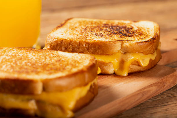 istock Grilled ham and cheese. Sandwich with cheese and ham on grill. 1313739987