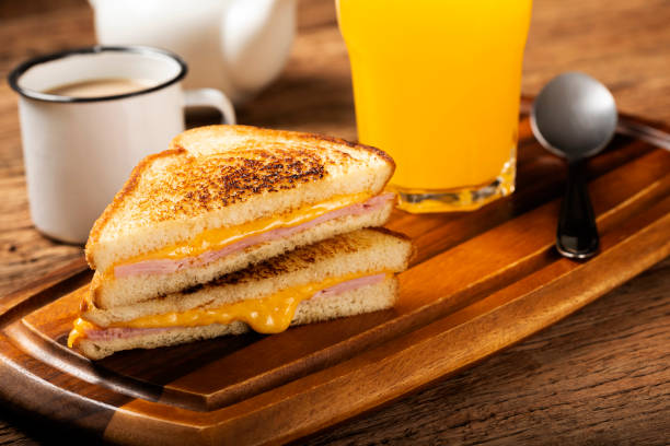 istock Grilled ham and cheese. Sandwich with cheese and ham on grill. 1313739988