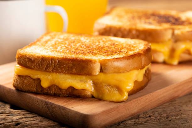 istock Grilled ham and cheese. Sandwich with cheese and ham on grill. 1313739991