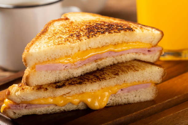 istock Grilled ham and cheese. Sandwich with cheese and ham on grill. 1313739997